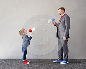 Funny child and senior man pretend to be businessmen