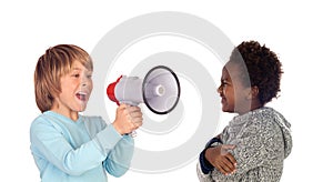 Funny child shouting through a megaphone to his friend