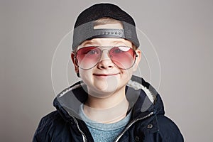 Funny child in sunglasses.smiling little boy