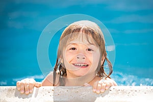 Funny child in swimming pool, close up face. Kids head portrait. Kids summer activities.