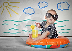 Funny child on swimming ring at home. Beach rest creative concept