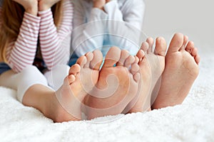 Funny children's foots is barefoot, closeup.