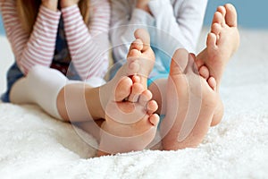 Funny children's foots is barefoot, closeup.