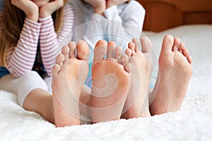 Funny children's foots is barefoot, closeup.