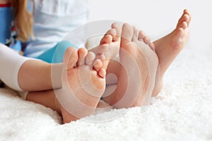 Funny children's foots is barefoot, closeup. photo