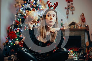 Funny Christmas Woman Pointing to a Piggy Bank