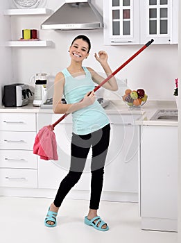 Funny cleaning woman in home