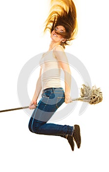 Funny cleaning woman with mop flying