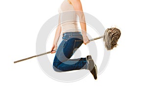 Funny cleaning woman with mop flying