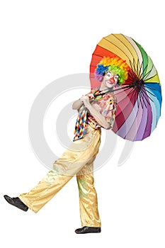 Funny clown with colorful umbrella
