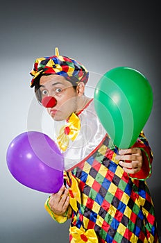 Funny clown in comical concept