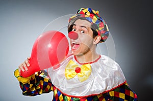 The funny clown in comical concept