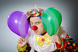 The funny clown in comical concept