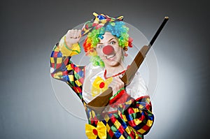 The funny clown in comical concept