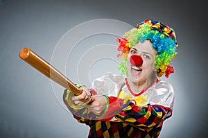 The funny clown in comical concept