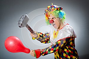 The funny clown in comical concept