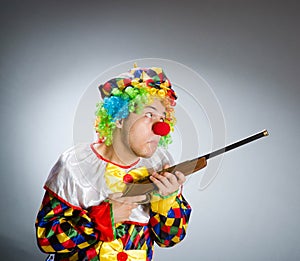 The funny clown in comical concept