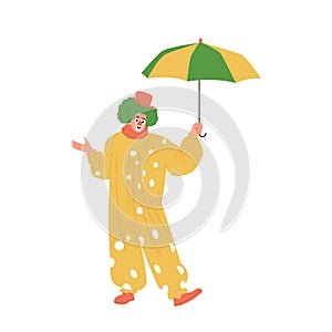 Funny clown in cute stage costume standing under umbrella, circus show entertainer character