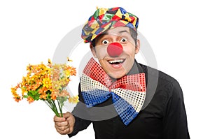The funny clown with flowers isolated on white