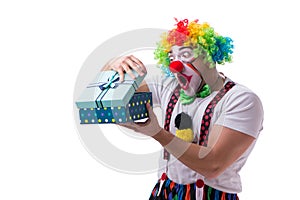 The funny clown with a gift present box isolated on white background