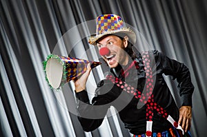 Funny clown in humorous concept