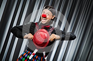 Funny clown in humorous concept