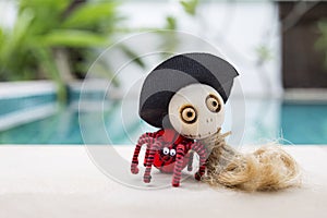 Funny colorful Halloween witch wooden doll with red wool spider