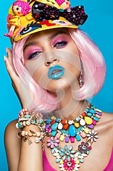 Funny comic girl with bright make-up in the style of pop art. Creative image. Beauty face.