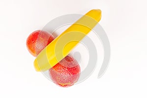 Funny concept of fruit, banana and two red oranges isolated on white background
