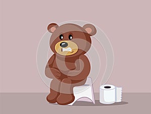 Funny Constipated Teddy Bear Sitting on the Potty Vector Cartoon