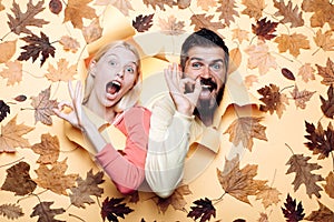 Funny couple are getting ready for autumn sale. Funny fac . Happy family in Autumn.