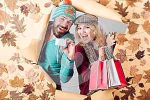 Funny couple are getting ready for autumn sale. Funny fac . Romantic couple in love. Clothing and color trends. Happy