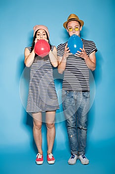 Funny couple in love with balls the studio