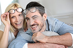 Funny couple removing eyeglasses