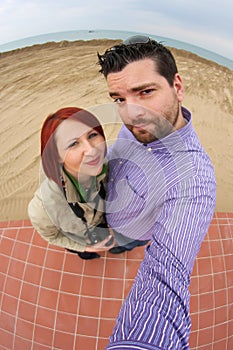 Funny couple taking fisheye selfie