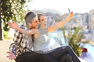 Funny couple taking selfies on vacation