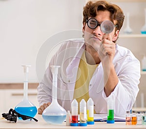 Funny crazy chemist doing experiments and tests
