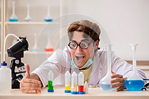 The funny crazy chemist doing experiments and tests