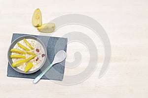 Funny cute kids childrens babys breakfast lunch oatmeal porridge in bowl look like hedgehog decoration with apple, dried