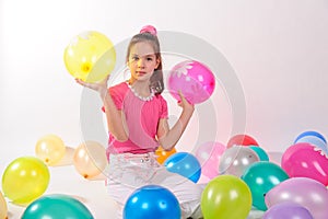 Funny cute little girl with baloons