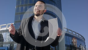 Funny dancing businessman on a street, outdoor