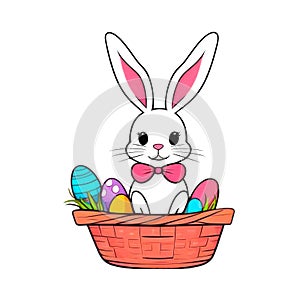 Funny Easter Rabbit in the Basket Isolated on white. Wicker basket of colorful eggs and cute white bunny