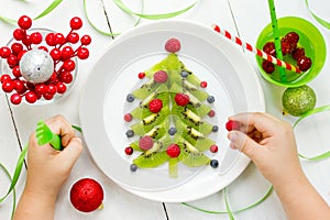 Funny edible Christmas tree for kids breakfast or dessert. Chris