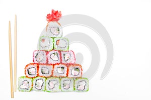 Funny edible Christmas tree made from sushi, creative idea for japanese restaurant on white background. New Year food