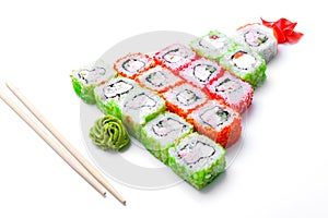 Funny edible Christmas tree made from sushi, creative idea for japanese restaurant on white background. New Year food