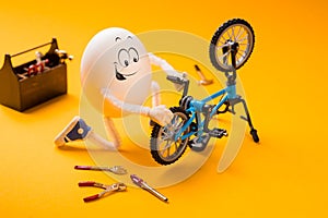 Funny egg repairing bike with various tools