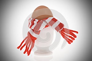 Funny egg with stripped scarf