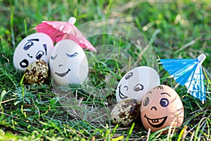 Funny eggs imitating two couples with versicolored babies photo