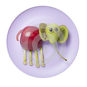 Funny elephant created from fruits on plate