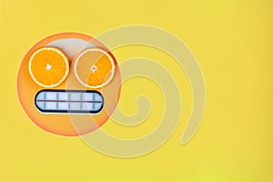 Funny emoji with slices citruses eyes